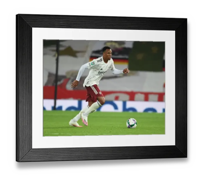 Framed Print : Arsenal's Gabriel at Anfield: Carabao Cup Clash Amid Empty Stands (Liverpool vs Arsenal, 2020-21)