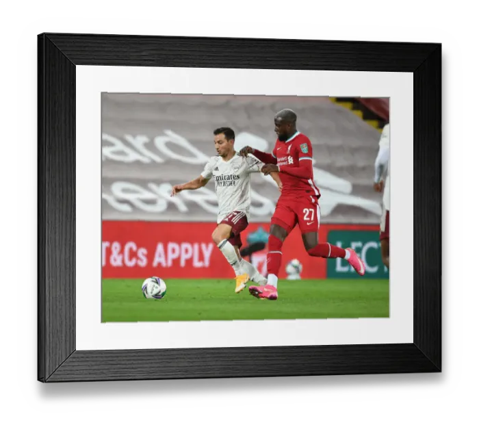 Framed Print : Arsenal's Cedric Battles Past Liverpool's Origi in Empty Anfield - Carabao Cup 2020-21