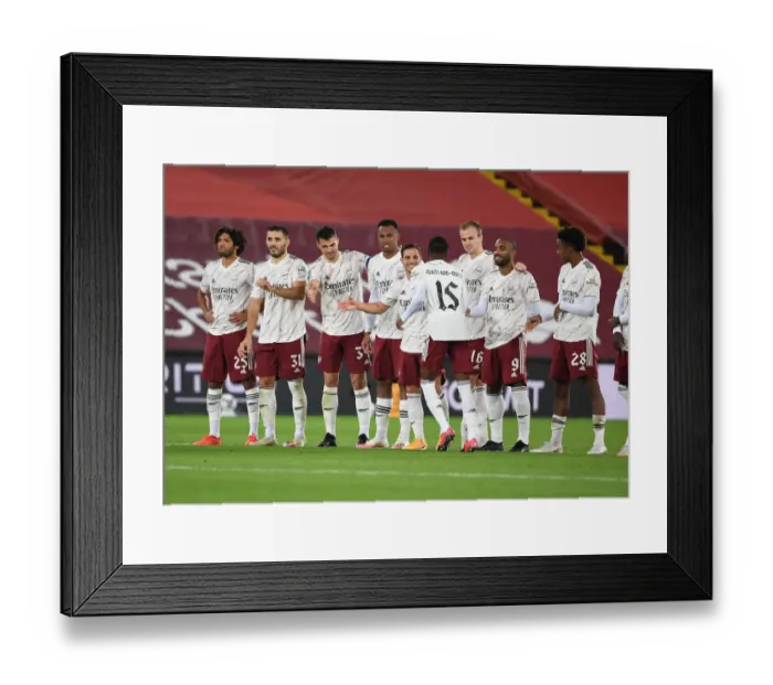 Framed Print : Arsenal's Ainsley Maitland-Niles Scores Decisive Penalty in Empty Anfield for Carabao Cup Upset over Liverpool