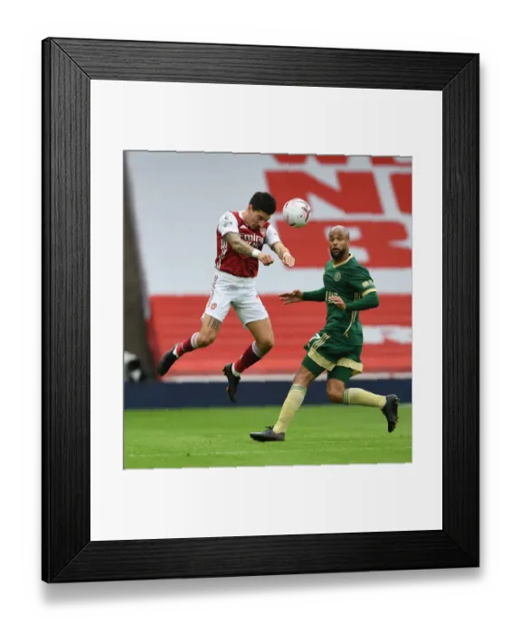 Framed Print : Arsenal's Hector Bellerin Overpowers Sheffield United's McGoldrick in Empty Emirates Stadium