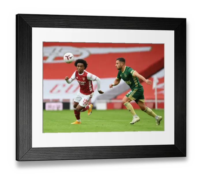 Framed Print : Arsenal's Willian Outmaneuvers Sheffield United's George Baldock in Empty Emirates Stadium Framed Print : Arsenal's Willian Outmaneuvers Sheffield United's George Baldock in Empty Emirates Stadium