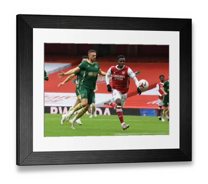 Framed Print : Arsenal's Eddie Nketiah Scores Past Sheffield United's Jack Robinson in Empty Emirates Stadium - Arsenal v Sheffield United, 2020-21 Premier League