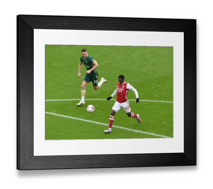 Framed Print : Arsenal's Eddie Nketiah Clashes with Sheffield United's Jack Robinson in Premier League Showdown