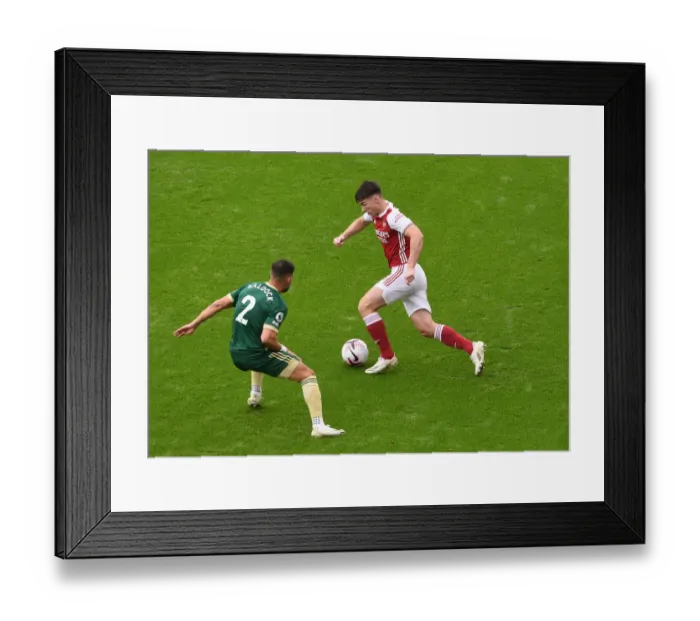Framed Print : Arsenal's Kieran Tierney Clashes with Sheffield United's George Baldock in Premier League Showdown Framed Print : Arsenal's Kieran Tierney Clashes with Sheffield United's George Baldock in Premier League Showdown