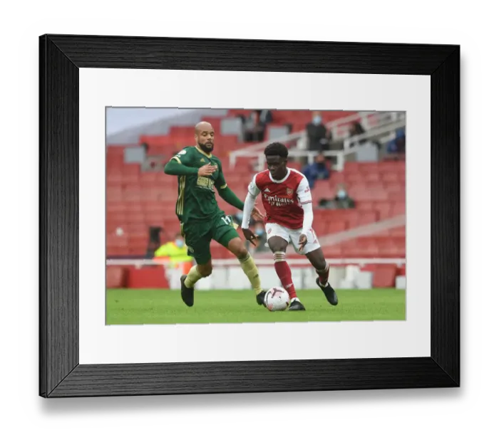 Framed Print : Saka vs McGoldrick: Intense Face-Off in Arsenal's Battle Against Sheffield United Framed Print : Saka vs McGoldrick: Intense Face-Off in Arsenal's Battle Against Sheffield United