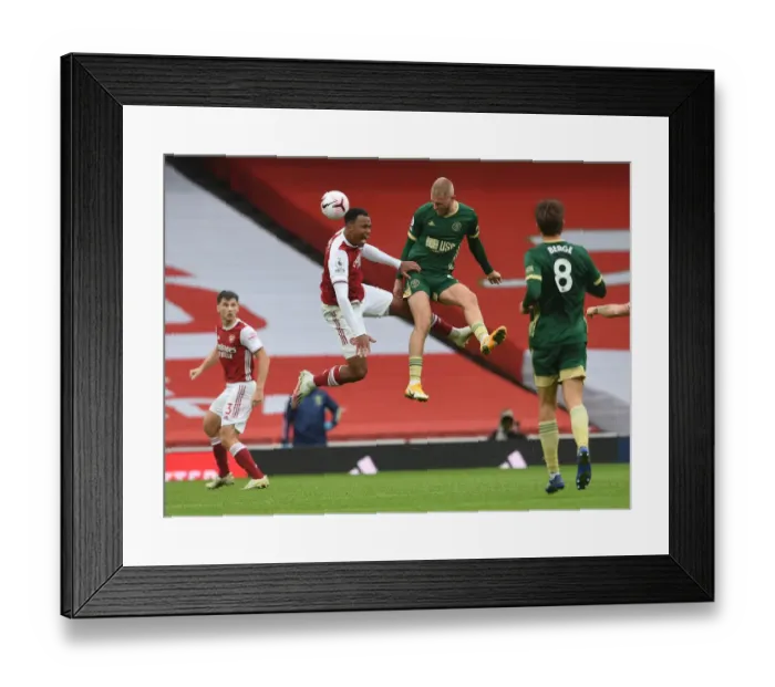 Framed Print : Arsenal vs Sheffield United: Gabriel Magalhaes Clashes with Oliver McBurnie in Premier League Showdown