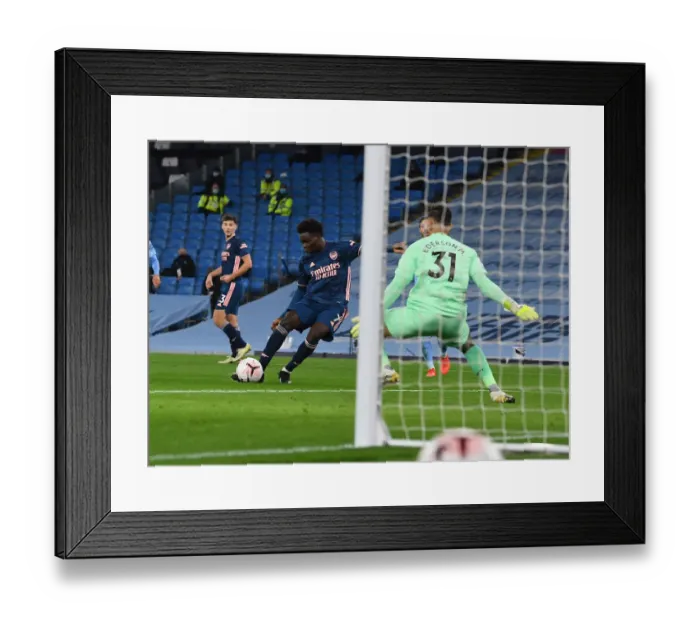 Framed Print : Manchester City vs Arsenal: Bukayo Saka's Thwarted Goal in Empty Etihad Stadium - Premier League 2020-21