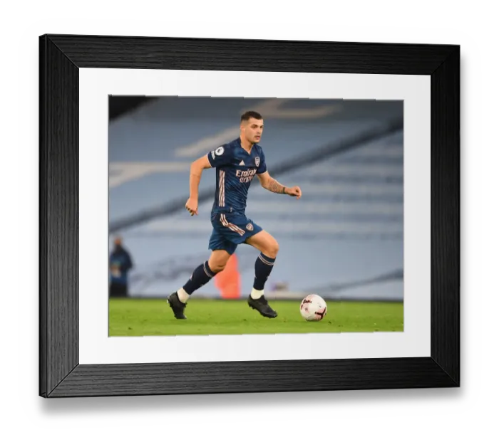 Framed Print : Empty Etihad: Xhaka's Intense Focus in Manchester City vs. Arsenal, 2020-21 Premier League