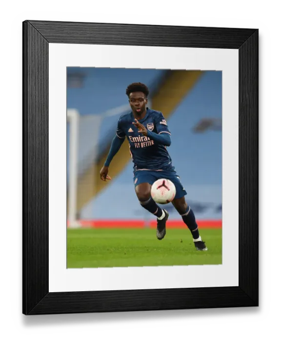 Framed Print : Bukayo Saka Faces Off: Arsenal vs. Manchester City, Premier League Showdown