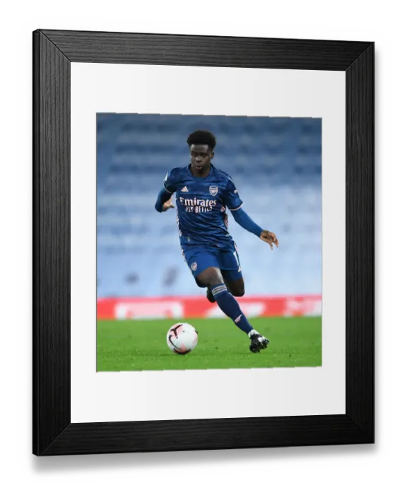 Framed Print : Bukayo Saka in Action: Manchester City vs. Arsenal, Premier League 2020-21 (Behind Closed Doors) Framed Print : Bukayo Saka in Action: Manchester City vs. Arsenal, Premier League 2020-21 (Behind Closed Doors)