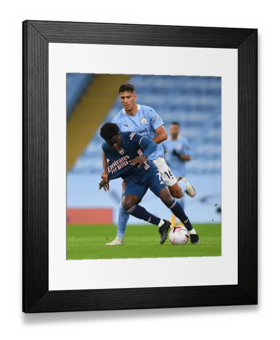 Framed Print : Saka vs Rodrigo: A Premier League Battle - Manchester City vs Arsenal (2020-21) Framed Print : Saka vs Rodrigo: A Premier League Battle - Manchester City vs Arsenal (2020-21)