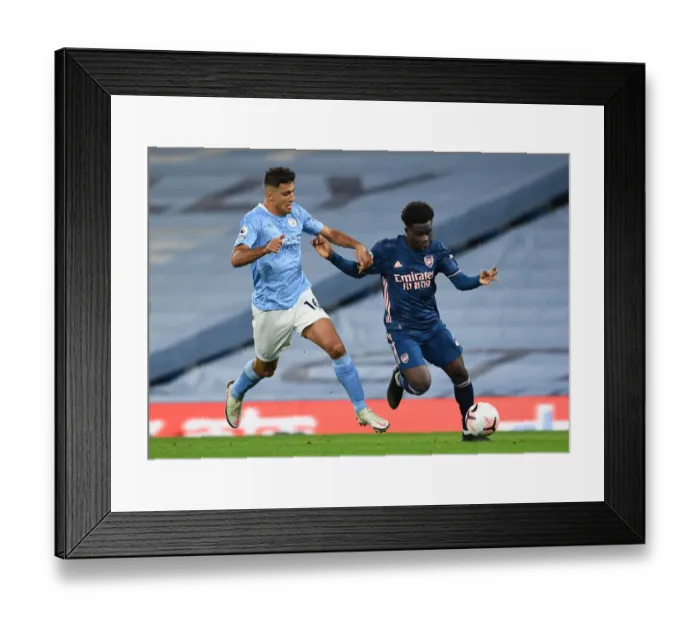 Framed Print : Saka vs Rodrigo: A Premier League Battle at Etihad Stadium (2020-21) Framed Print : Saka vs Rodrigo: A Premier League Battle at Etihad Stadium (2020-21)