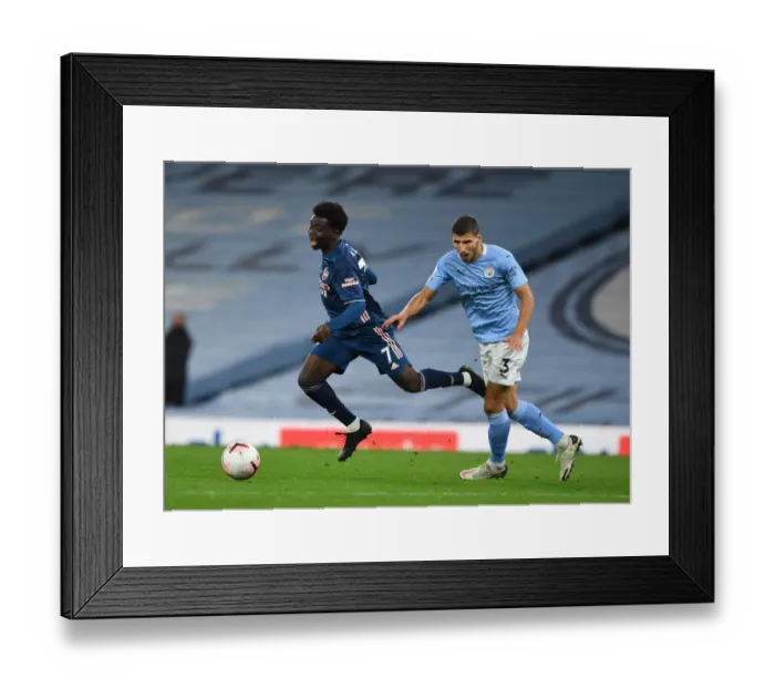 Framed Print : Manchester City vs Arsenal: Bukayo Saka Fouled by Ruben Dias in 2020-21 Premier League Clash Framed Print : Manchester City vs Arsenal: Bukayo Saka Fouled by Ruben Dias in 2020-21 Premier League Clash