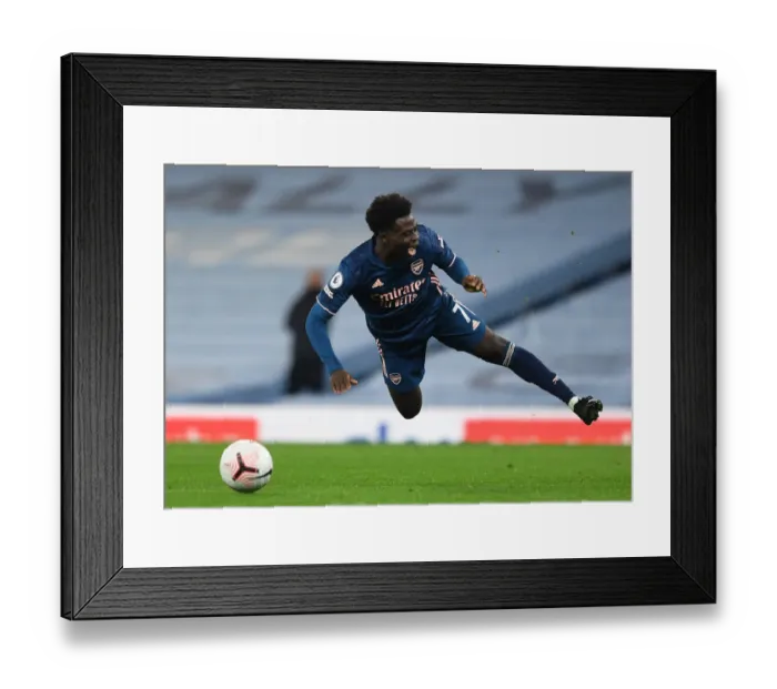 Framed Print : Arsenal's Bukayo Saka Faces Off Against Manchester City in Premier League Clash