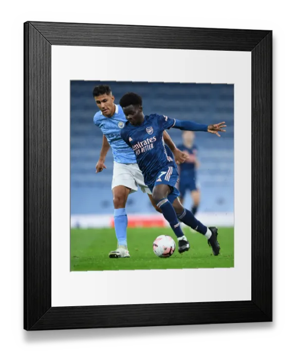 Framed Print : Saka vs Rodrigo: A Battle at the Etihad - Manchester City vs Arsenal, Premier League 2020-21 Framed Print : Saka vs Rodrigo: A Battle at the Etihad - Manchester City vs Arsenal, Premier League 2020-21