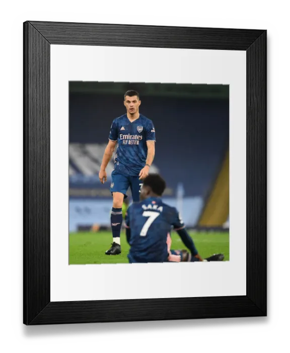 Framed Print : Behind Closed Doors: Granit Xhaka at Etihad Stadium - Arsenal vs Manchester City, 2020-21 Premier League Framed Print : Behind Closed Doors: Granit Xhaka at Etihad Stadium - Arsenal vs Manchester City, 2020-21 Premier League