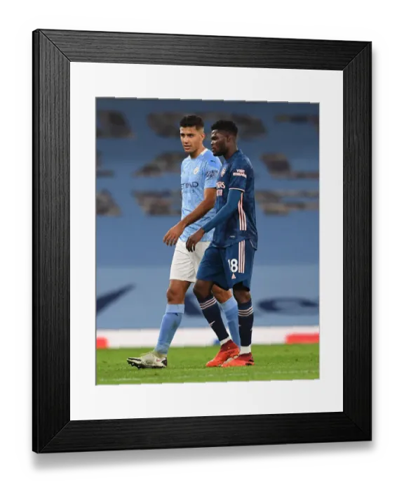 Framed Print : Manchester Derby: Thomas Partey and Rodrigo Share a Moment after Manchester City vs. Arsenal (2020-21) Framed Print : Manchester Derby: Thomas Partey and Rodrigo Share a Moment after Manchester City vs. Arsenal (2020-21)