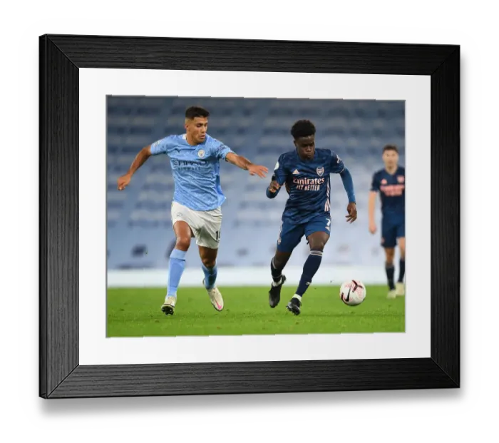 Framed Print : Bukayo Saka vs Rodrigo: Manchester City vs Arsenal, Premier League Showdown (2020-21)