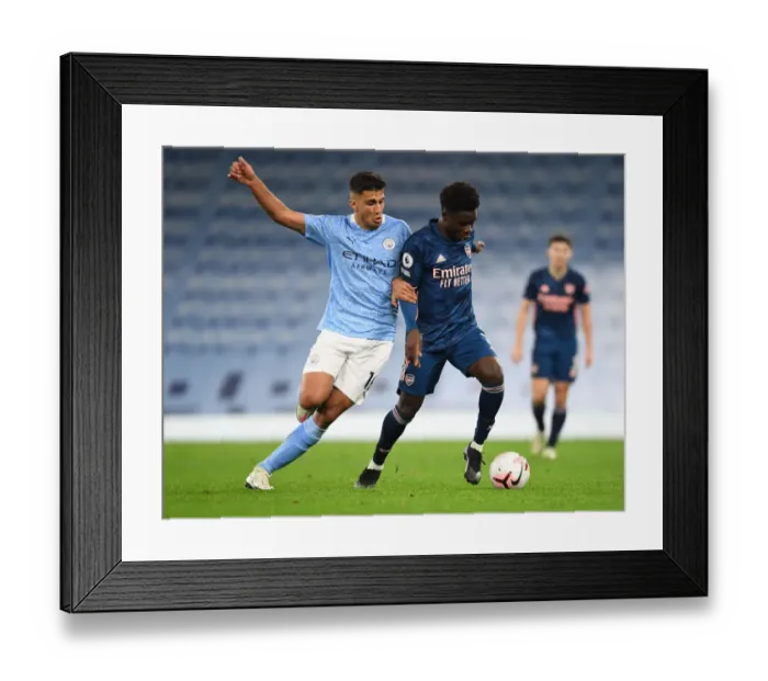 Framed Print : Manchester City vs Arsenal: Bukayo Saka Faces Rodrigo in Empty Etihad Stadium - Premier League 2020-21