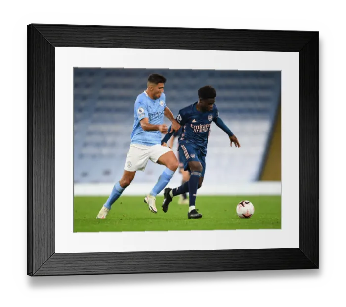 Framed Print : Saka vs Rodrigo: A Premier League Showdown at the Etihad (2020-21)