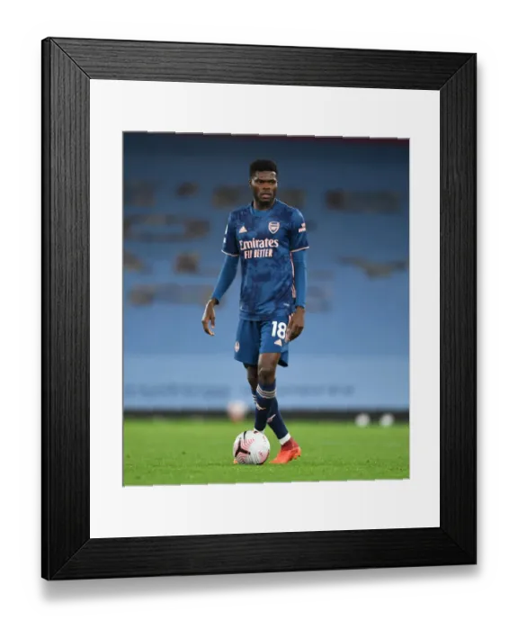 Framed Print : Thomas Partey: Arsenal's Midfield Star Shines in Empty Etihad Stadium