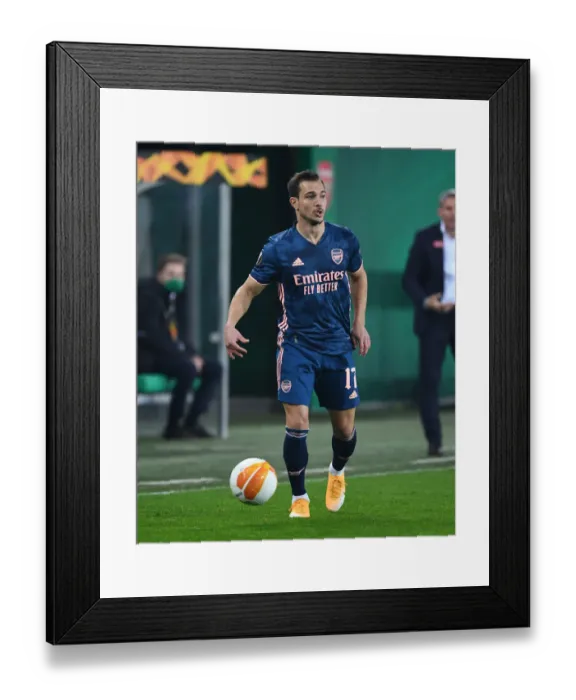 Framed Print : Arsenal's Cedric Faces Off Against Rapid Vienna in Europa League Clash Framed Print : Arsenal's Cedric Faces Off Against Rapid Vienna in Europa League Clash