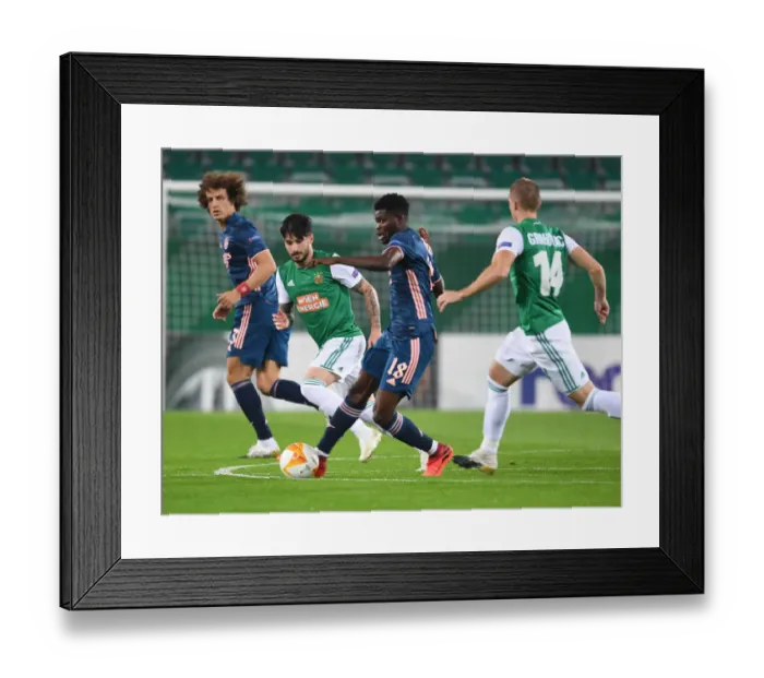 Framed Print : Thomas Partey: Arsenal's Midfield Maestro Shines in Europa League Clash Against Rapid Vienna
