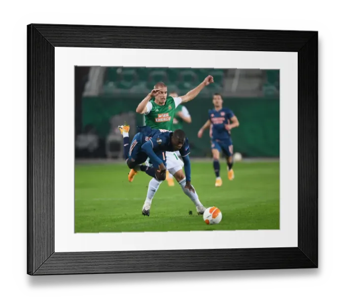 Framed Print : Intense Clash: Partey Fouls and Dramatic Moments - Rapid Vienna vs. Arsenal FC, Europa League