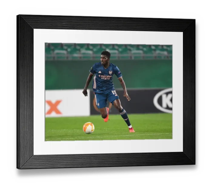 Framed Print : Thomas Partey in Action: Arsenal's Midfield Maestro Shines in Europa League Clash against Rapid Vienna Framed Print : Thomas Partey in Action: Arsenal's Midfield Maestro Shines in Europa League Clash against Rapid Vienna