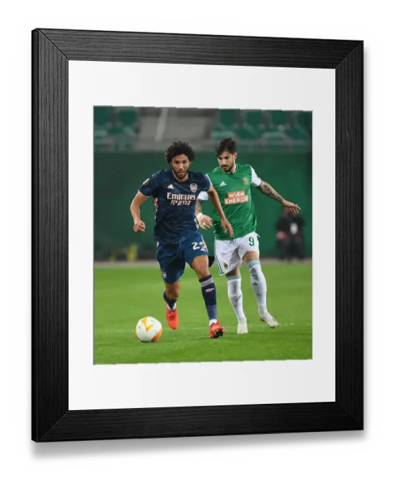 Framed Print : Arsenal's Mo Elneny Overpowers Rapid Wien's Taxiarchis Fountas in Europa League Clash