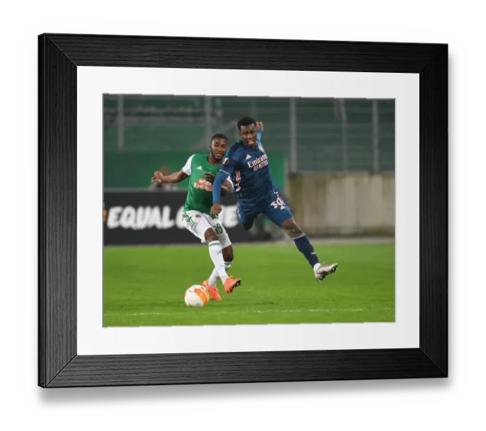 Framed Print : Arsenal's Eddie Nketiah Faces Off Against Rapid Wien's Kelvin Arase in Europa League Clash Framed Print : Arsenal's Eddie Nketiah Faces Off Against Rapid Wien's Kelvin Arase in Europa League Clash