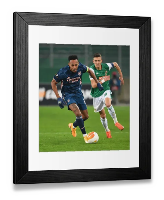 Framed Print : Aubameyang Breaks Past Rapid Wien: Arsenal's Europa League Victory