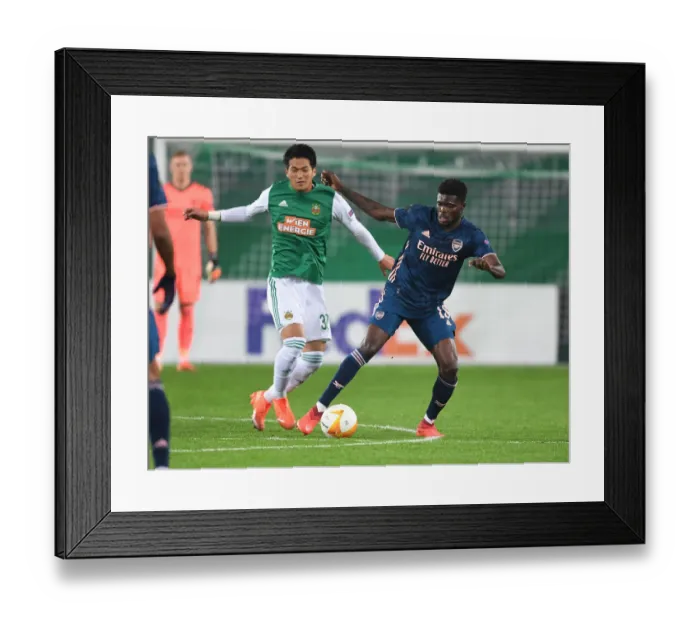 Framed Print : Thomas Partey's Europa League Breakthrough: Surging Past Rapid Wien's Koya Kitagawa
