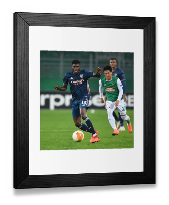 Framed Print : Thomas Partey in Action: Arsenal vs Rapid Vienna, UEFA Europa League 2020-21 Framed Print : Thomas Partey in Action: Arsenal vs Rapid Vienna, UEFA Europa League 2020-21