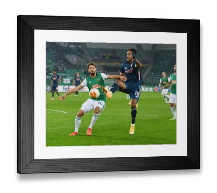 Framed Print : Aubameyang vs Hofmann: Clash in the Europa League between Rapid Vienna and Arsenal Framed Print : Aubameyang vs Hofmann: Clash in the Europa League between Rapid Vienna and Arsenal
