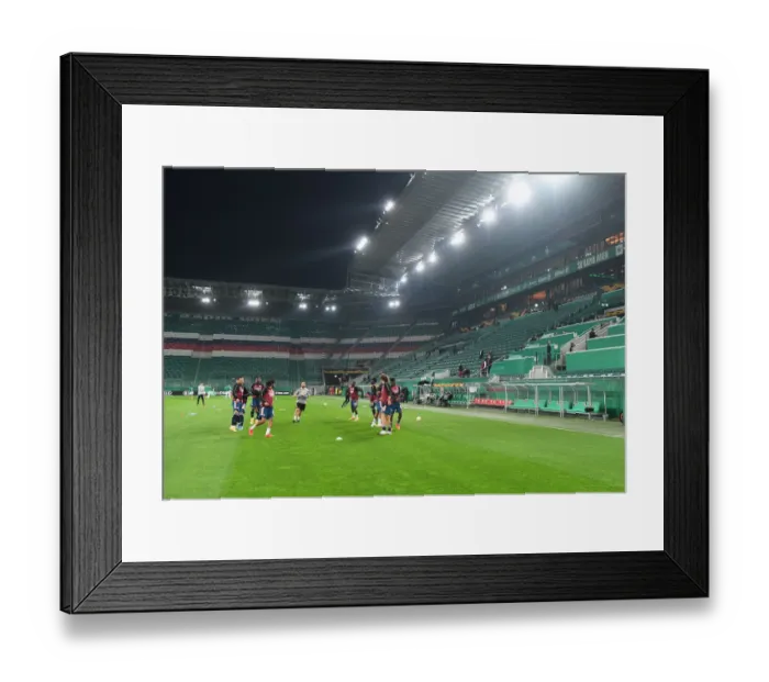 Framed Print : Arsenal FC Warm-Up Ahead of Rapid Vienna Clash in Europa League