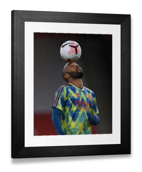 Framed Print : Alex Lacazette Prepares for Arsenal vs. Leicester Clash in Empty Emirates Stadium (2020-21 Premier League)
