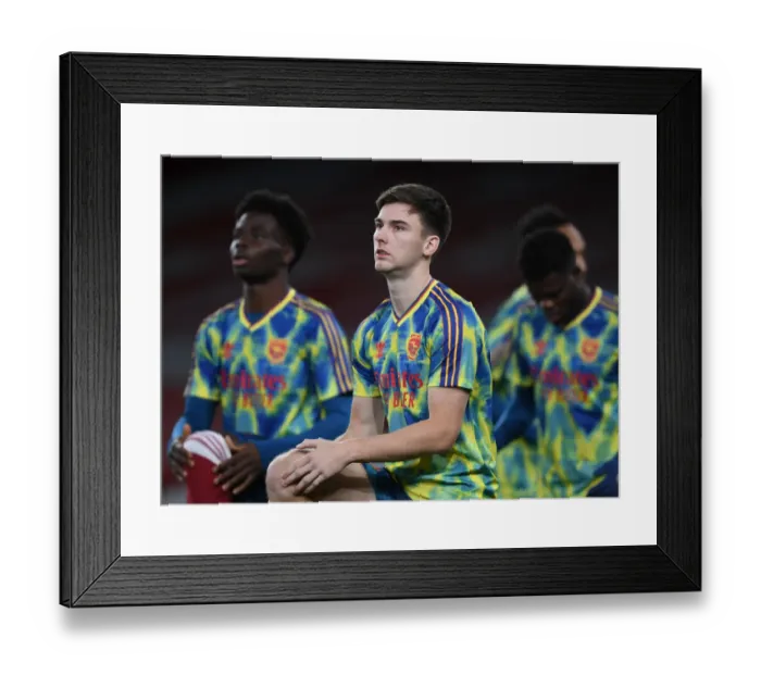 Framed Print : Arsenal's Kieran Tierney: Pre-Match Focus at Empty Emirates Stadium vs Leicester City (2020-21)