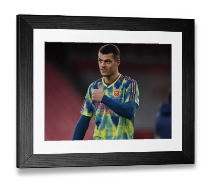 Framed Print : Granit Xhaka's Pre-Match Focus: Arsenal vs Leicester City (2020-21) at Empty Emirates Stadium