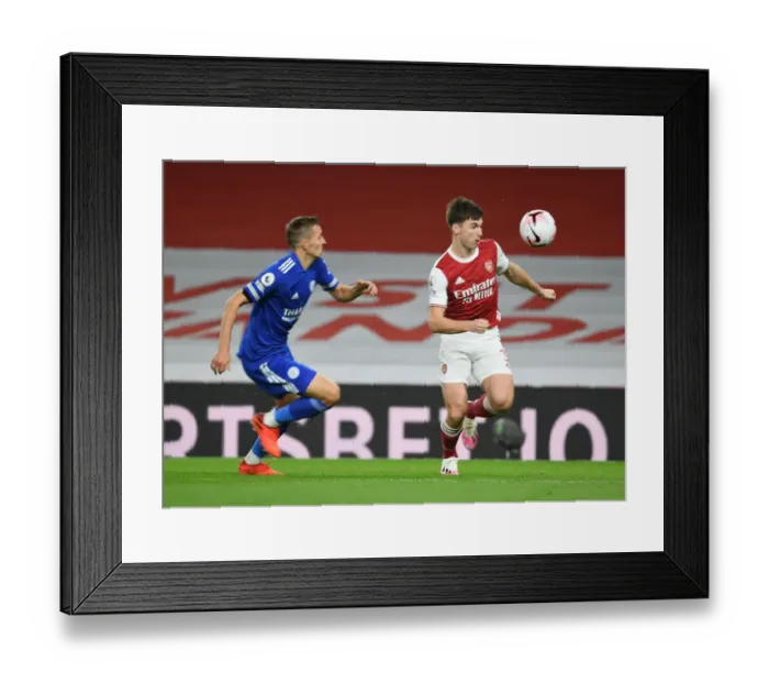 Framed Print : Arsenal's Kieran Tierney Outmaneuvers Leicester City's Timothy Castagne in Empty Emirates Stadium