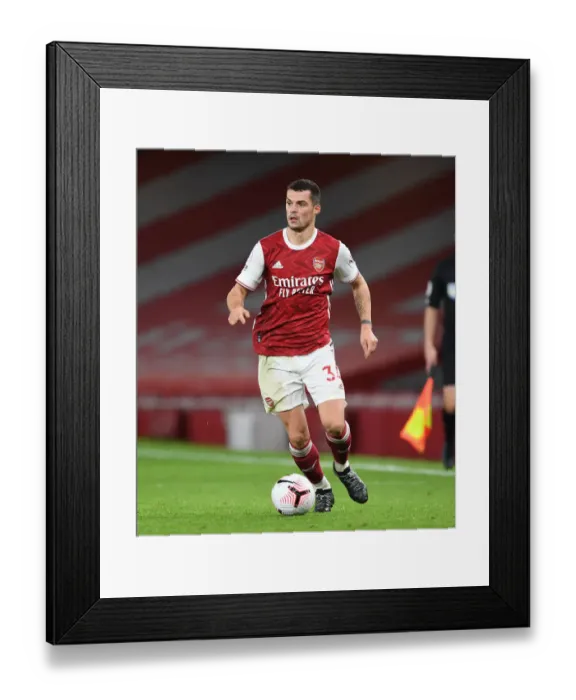 Framed Print : Arsenal's Xhaka in Action: Battle at Emirates Amidst Pandemic Restrictions - Arsenal vs. Leicester City (2020-21)