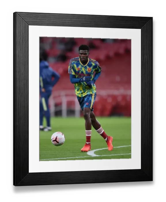 Framed Print : Thomas Partey Prepares for Arsenal vs Leicester Showdown at Empty Emirates Stadium (2020-21) Framed Print : Thomas Partey Prepares for Arsenal vs Leicester Showdown at Empty Emirates Stadium (2020-21)