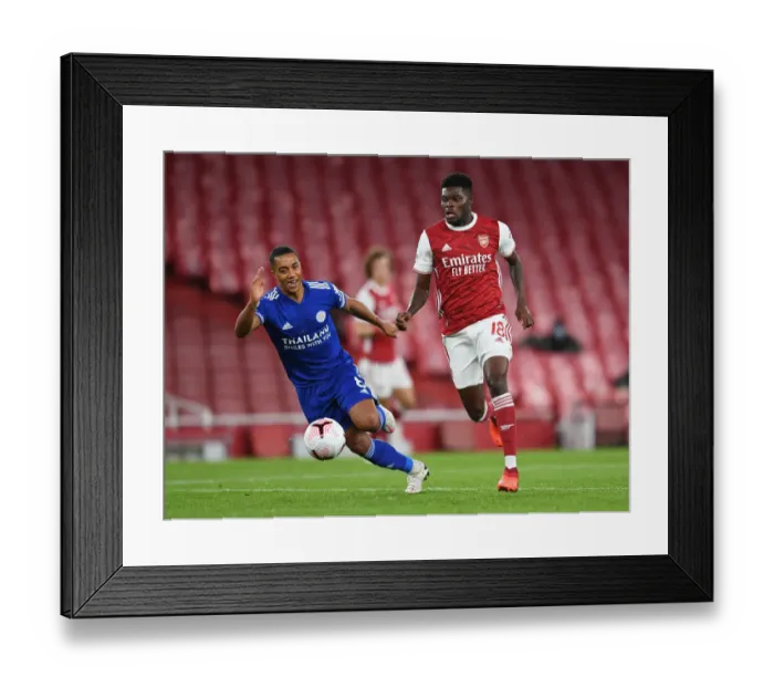 Framed Print : Clash of Midfield Titans: Partey vs Tielemans in Empty Emirates Stadium