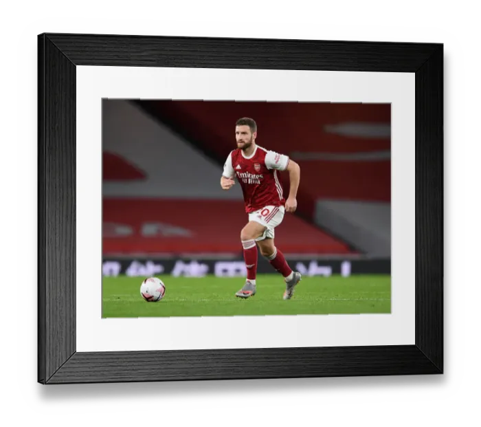 Framed Print : Arsenal vs Leicester: Mustafi's Focus Amid Emirates Empty Stands During COVID-19