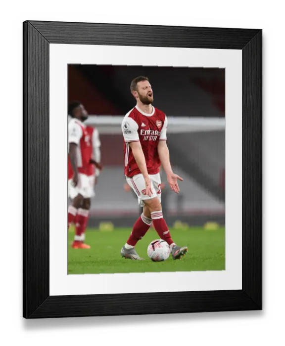Framed Print : Arsenal vs Leicester Showdown: Mustafi's Determination Amidst Emirates Empty Seats (October 2020)
