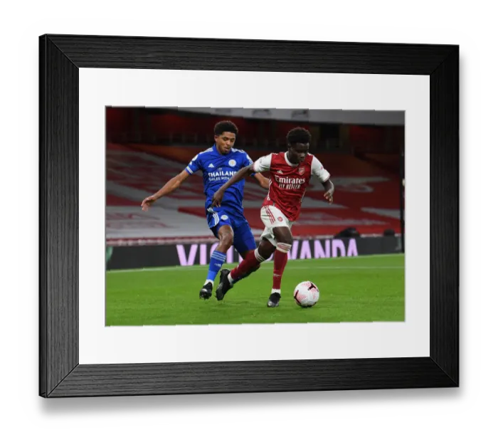 Framed Print : Arsenal vs Leicester City: Bukayo Saka vs Wesley Fofana Clash in Empty Emirates Stadium