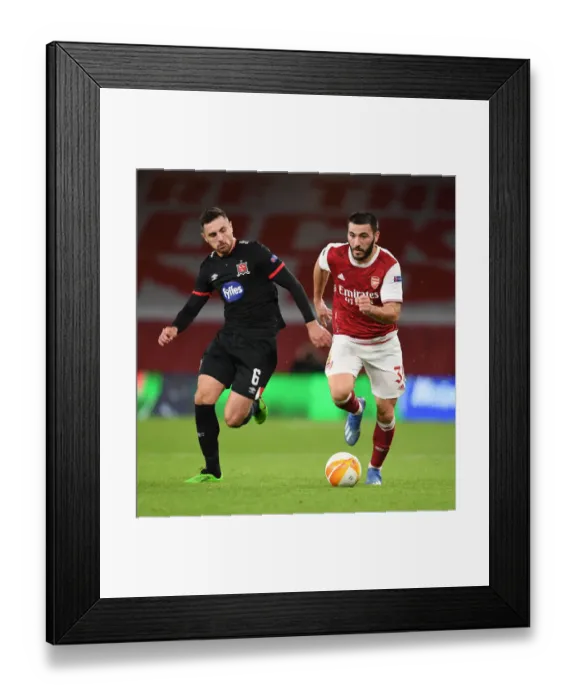 Framed Print : Arsenal's Sead Kolasinac Overpowers Dundalk's Jordan Flores in Empty Emirates Stadium - UEFA Europa League 2020-21 Framed Print : Arsenal's Sead Kolasinac Overpowers Dundalk's Jordan Flores in Empty Emirates Stadium - UEFA Europa League 2020-21
