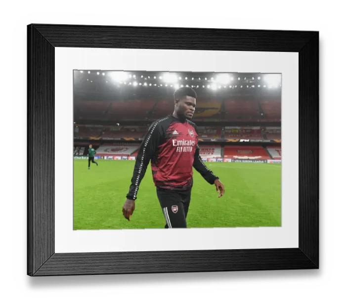 Framed Print : Thomas Partey Prepares for Arsenal's Europa League Clash Against Dundalk Amid Empty Emirates Stadium Framed Print : Thomas Partey Prepares for Arsenal's Europa League Clash Against Dundalk Amid Empty Emirates Stadium