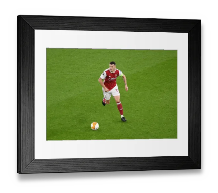 Framed Print : Arsenal's Granit Xhaka in UEFA Europa League Action Against Dundalk Amid Empty Emirates Stadium Framed Print : Arsenal's Granit Xhaka in UEFA Europa League Action Against Dundalk Amid Empty Emirates Stadium