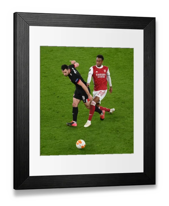 Framed Print : LONDON, ENGLAND - OCTOBER 29: Joe Willock of Arsenal challenges Patrick Hoban of Dundalk during the UEFA Europa League